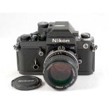 Black Nikon F2 AS Photomic with a Fast 85mm f2 Portrait Lens.