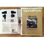 Approx 40 Olympus OM Camera Brochures & a 1979 Olympus Sales Information File.