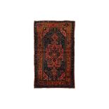 AN ANTIQUE KURDISH RUG