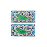 A PAIR OF MULTAN POTTERY TILES WITH GREEN PARAKEET Multan, Sindh, Punjab, first half 20th century