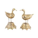 A PAIR OF ENGRAVED AND OPENWORK SILVERED BRASS INCENSE BURNERS IN THE SHAPE OF DUCKS Possibly Isfaha