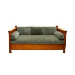 A BIEDERMEIER STYLE SATIN BIRCH THREE SEATER SETTEE