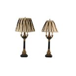 TWO PAIRS OF NEOCLASSICAL STYLE EBONISED AND PARCEL GILT TABLE LAMPS