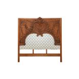 A RELIEF CARVED OAK PANEL HEADBOARD