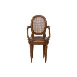 A 19TH CENTURY CANED MAHOGANY ARMCHAIR