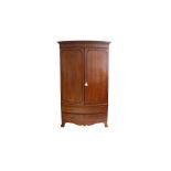 A LATE 19TH CENTURY MAHOGANY BOW FRONT WARDROBE