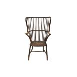 AN EARLY 20TH CENTURY STAINED BEECH AND ASH WING BACK WINDSOR ARMCHAIR