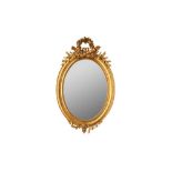 A FRENCH GILT OVAL MIRROR