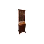 A 19TH CENTURY NARROW MAHOGANY BUREAU BOOKCASE