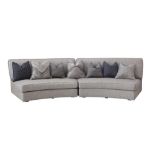 A LARGE CONTEMPORARY CURVED SOFA