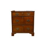 A GEORGIAN STYLE CROSSBANDED WALNUT CHEST OF DRAWERS