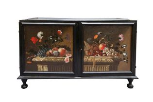 A NORTH EUROPEAN PAINTED AND EBONISED TABLE CABINET