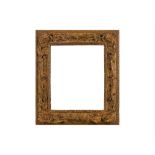 AN ENGLISH 18TH TH CENTURY CARVED, PIERCED, SWEPT AND GILDED FRAME