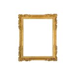 A FRENCH LOUIS XIV CARVED AND GILDED LEBRUN (18TH CENTURY) FRAME