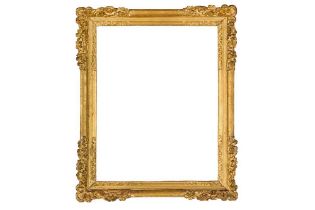 A FRENCH LOUIS XIV CARVED AND GILDED LEBRUN (18TH CENTURY) FRAME