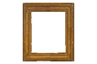 A FRENCH 19TH CENTURY GILDED COMPOSITION EMPIRE FRAME