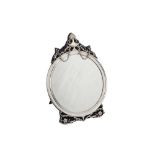 An Edwardian sterling silver mounted dressing table mirror, London 1909 by William Comyns