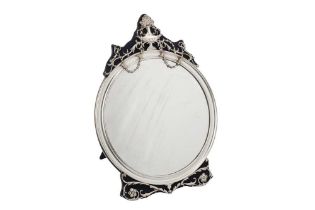 An Edwardian sterling silver mounted dressing table mirror, London 1909 by William Comyns