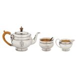 A George V sterling silver three-piece tea service, London 1914 by Robert Pringle and Sons