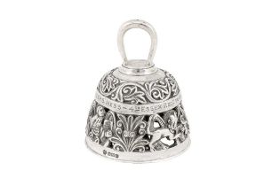 A heavy Edwardian sterling silver cast table bell, Sheffield 1905 by William Hutton and Sons