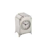 A George V sterling silver cased timepiece or carriage clock, London 1912 by William Comyns, retaile