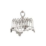 A Victorian sterling silver seven bar toast rack, London 1846 by John Evans