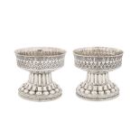 A pair of Edwardian sterling silver replica of the Holms Cup bowls, Chester 1906 by Nathan and Hayes