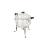An early 19th century Indian colonial silver curry and milk pan upon burner stand, Calcutta circa 18