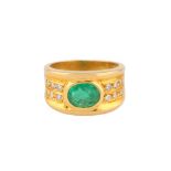 AN EMERALD AND DIAMOND RING