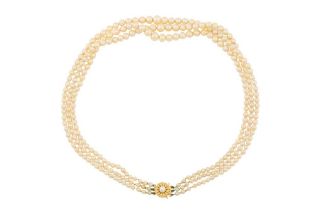 A THREE-STRAND CULTURED PEARL NECKLACE