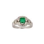 AN EMERALD AND DIAMOND RING