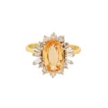 A TOPAZ AND DIAMOND RING