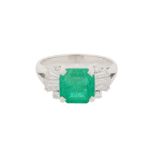 AN EMERALD AND DIAMOND RING