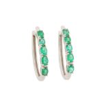 A PAIR OF EMERALD HALF HOOP EARRINGS