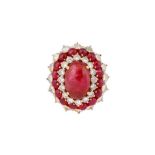 A CABOCHON RUBY AND DIAMOND CLUSTER RING