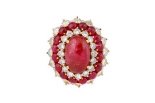 A CABOCHON RUBY AND DIAMOND CLUSTER RING