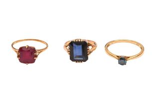 THREE SYNTHETIC GEM-SET RINGS