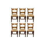 A SET OF SIX CONTEMPORARY RUSTIC OAK BAR BACK DINING CHAIRS