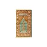 A FINE SILK PRAYER RUG OF LADIK DESIGN