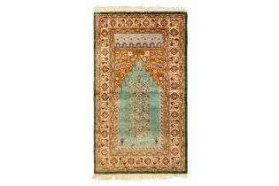 A FINE SILK PRAYER RUG OF LADIK DESIGN