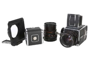 A Hasselblad 500C/M chrome kit with CF 80mm F2.8 and 60mm 3.5 lenses.