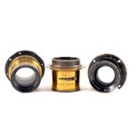 Three Ross Brass Bound Lenses.