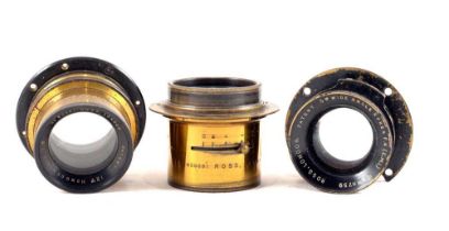 Three Ross Brass Bound Lenses.
