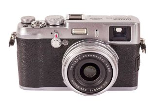 A Fuji X100 camera and accessories.