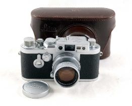 A Leica IIIG with f2 Summicron Lens.