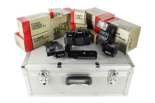 A Canon F-1 SLR Camera with Accessories.