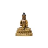 A SINO-TIBETAN PARCEL-GILT BRONZE FIGURE OF BUDDHA SHAKYAMUNI 清十八世紀 銅鎏金釋迦牟尼佛像