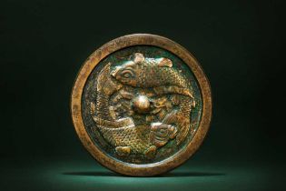 A CHINESE BRONZE 'TWIN CARP' MIRROR 金 銅雙魚紋鏡