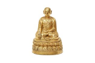 A TIBETAN GILT-BRONZE FIGURE OF A LAMA 十五世紀 銅鎏金喇嘛坐像