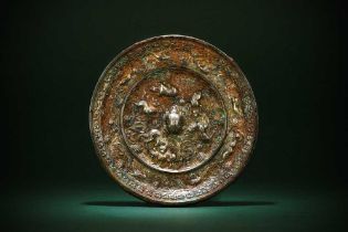 A CHINESE SILVERED BRONZE 'LION AND GRAPEVINE' MIRROR 唐 狻猊葡萄紋鍍銀銅鏡